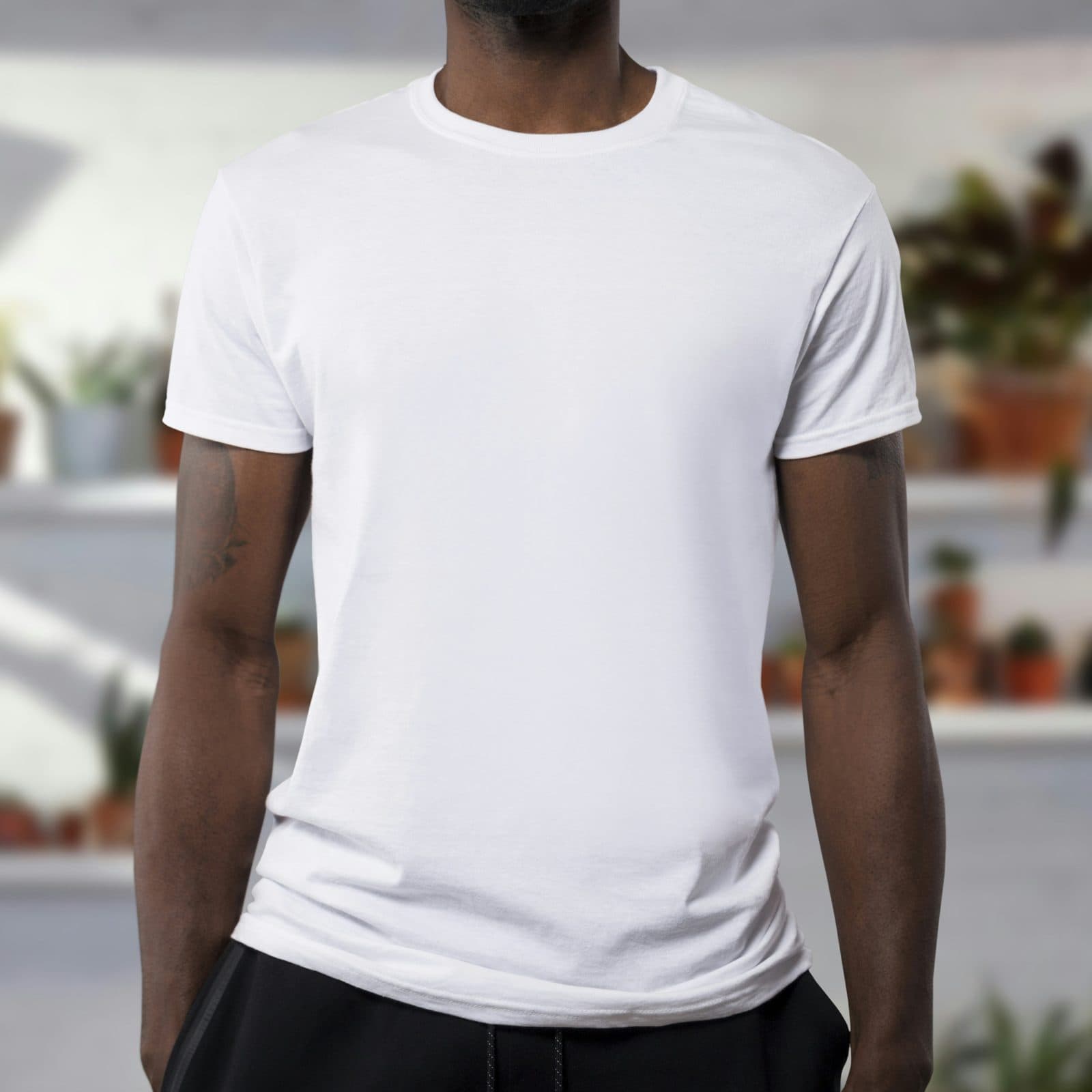Plain white crew-neck cotton T-shirt worn by a model