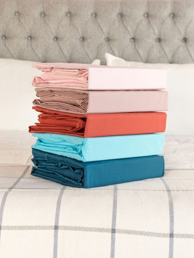 Folded plain dyed cotton bedsheet sets